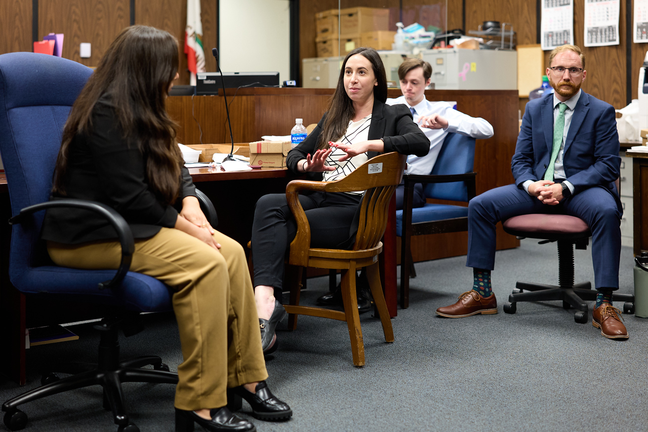 Elyse Kupfer speaks with peers at a courthouse orientation event