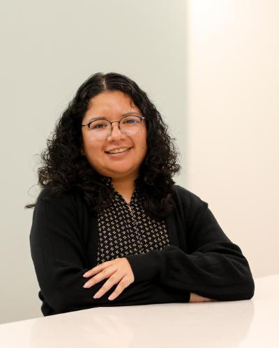 LSJLC Fellow Stacy Nunez Poses at Table