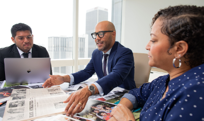 George Fatheree Excitedly Shares Ebony Magazine Issues at Conference Table 3