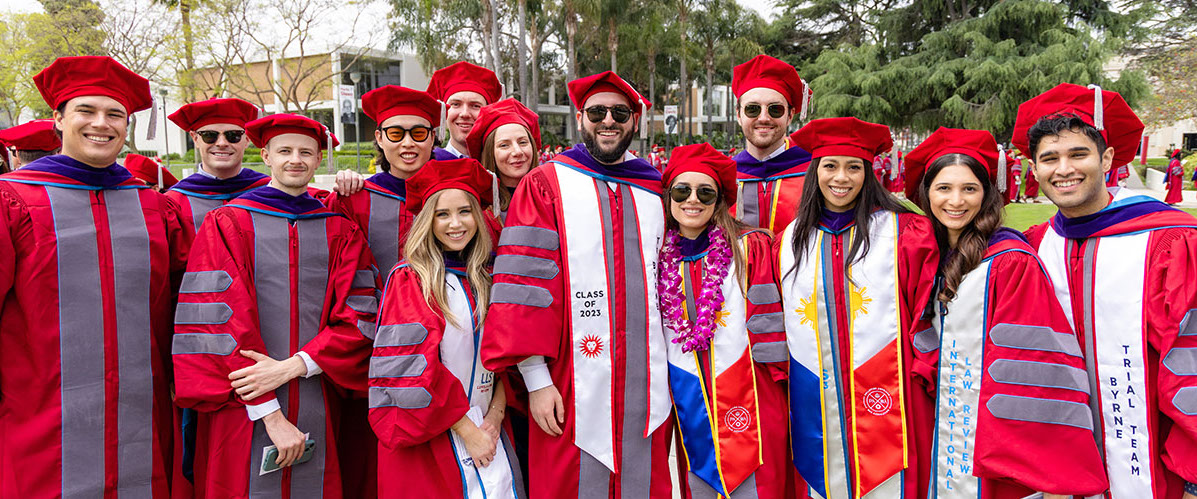 students in red regalia