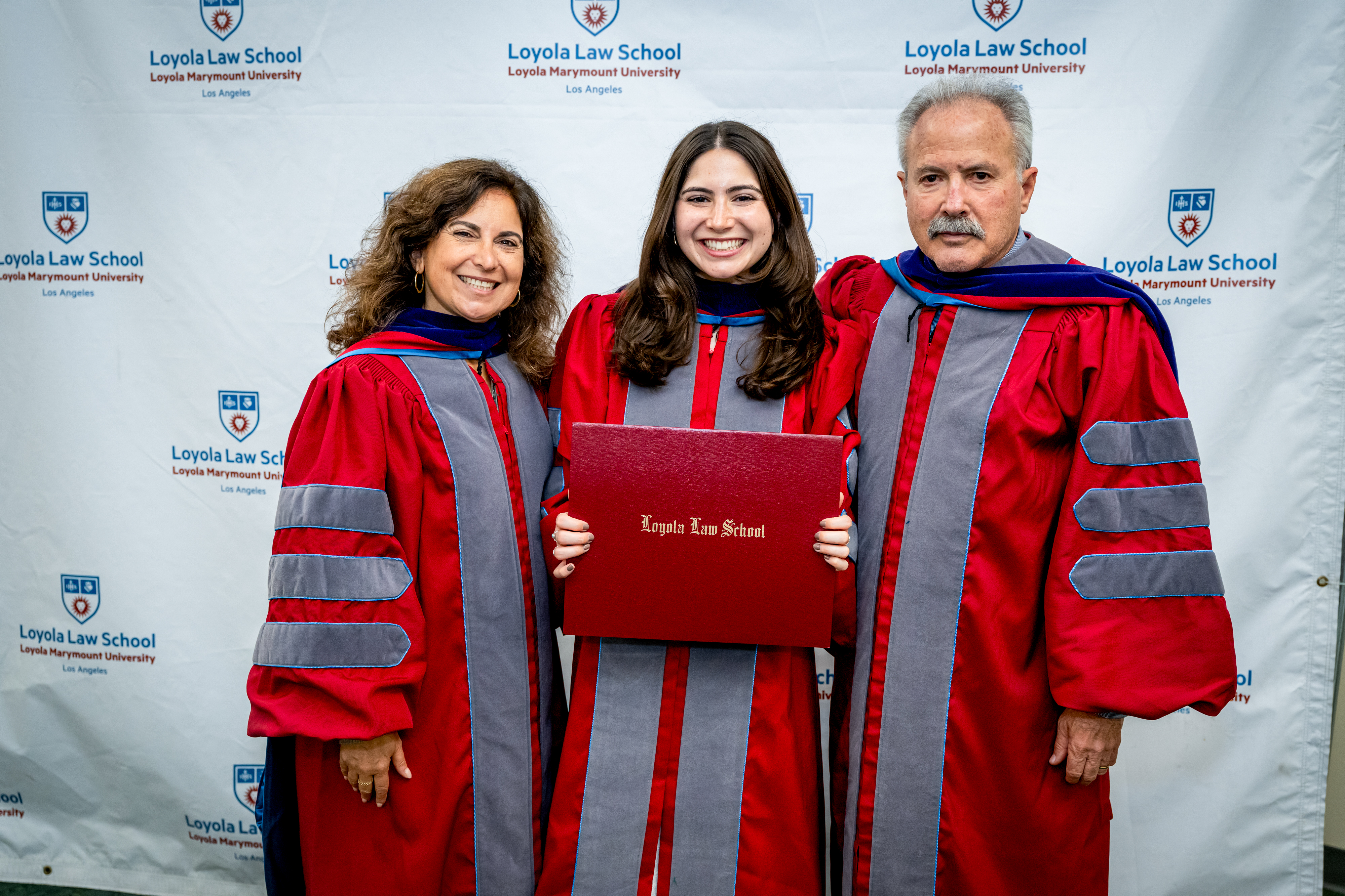 Student and Family in LLS Red Regalia