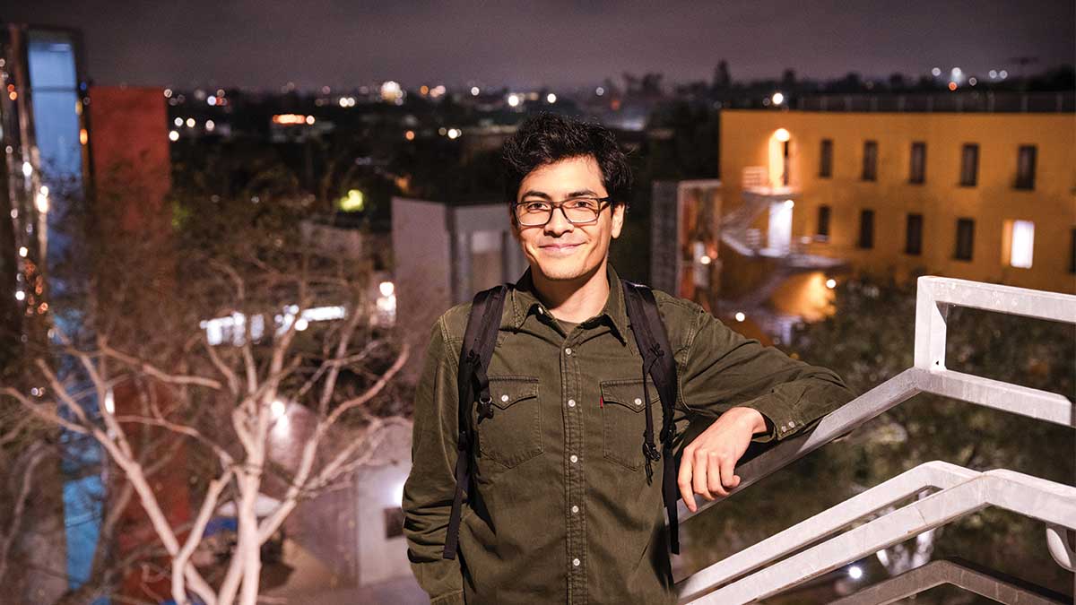 An LLS Student on campus at night